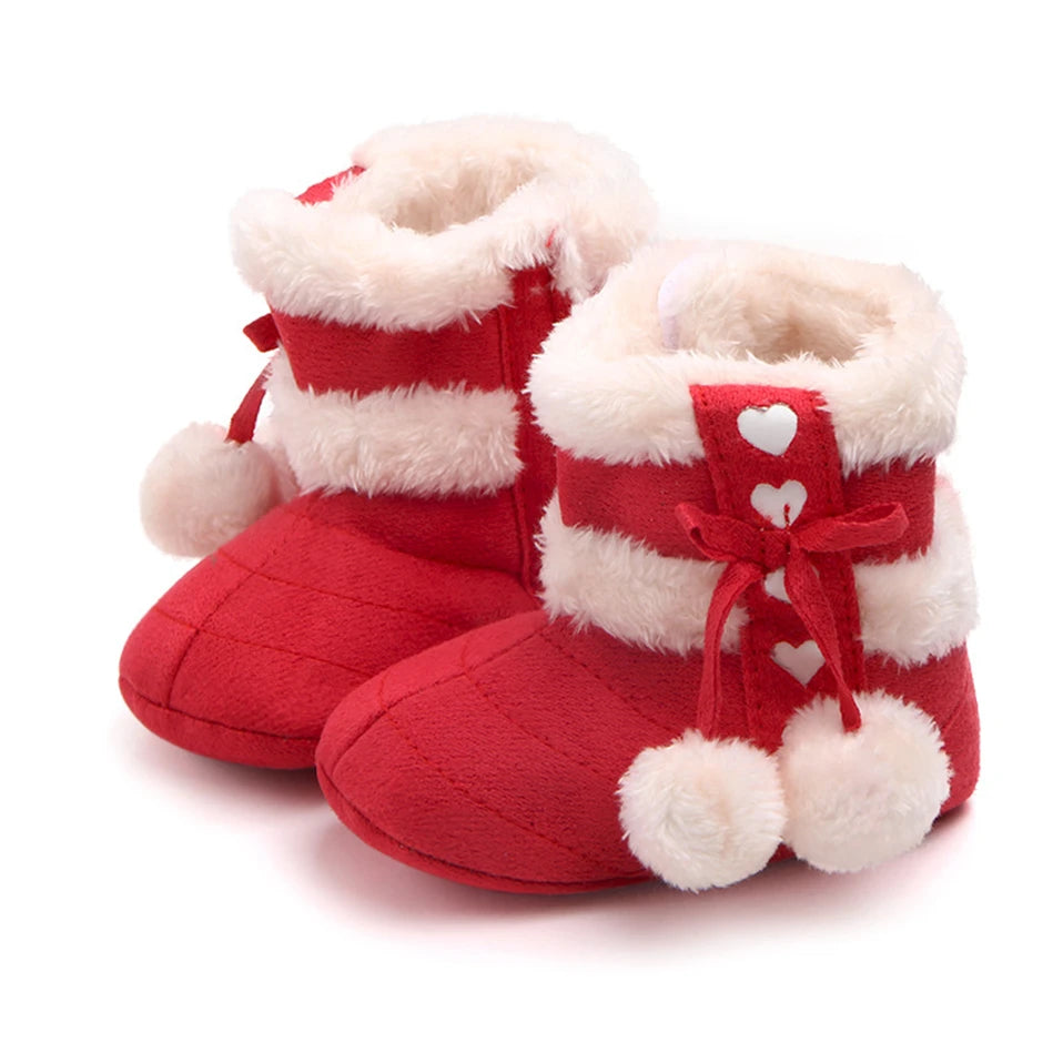 Winterberry Heart Boots for babies in rich berry red, featuring faux fur lining, heart details, and fluffy pom poms.