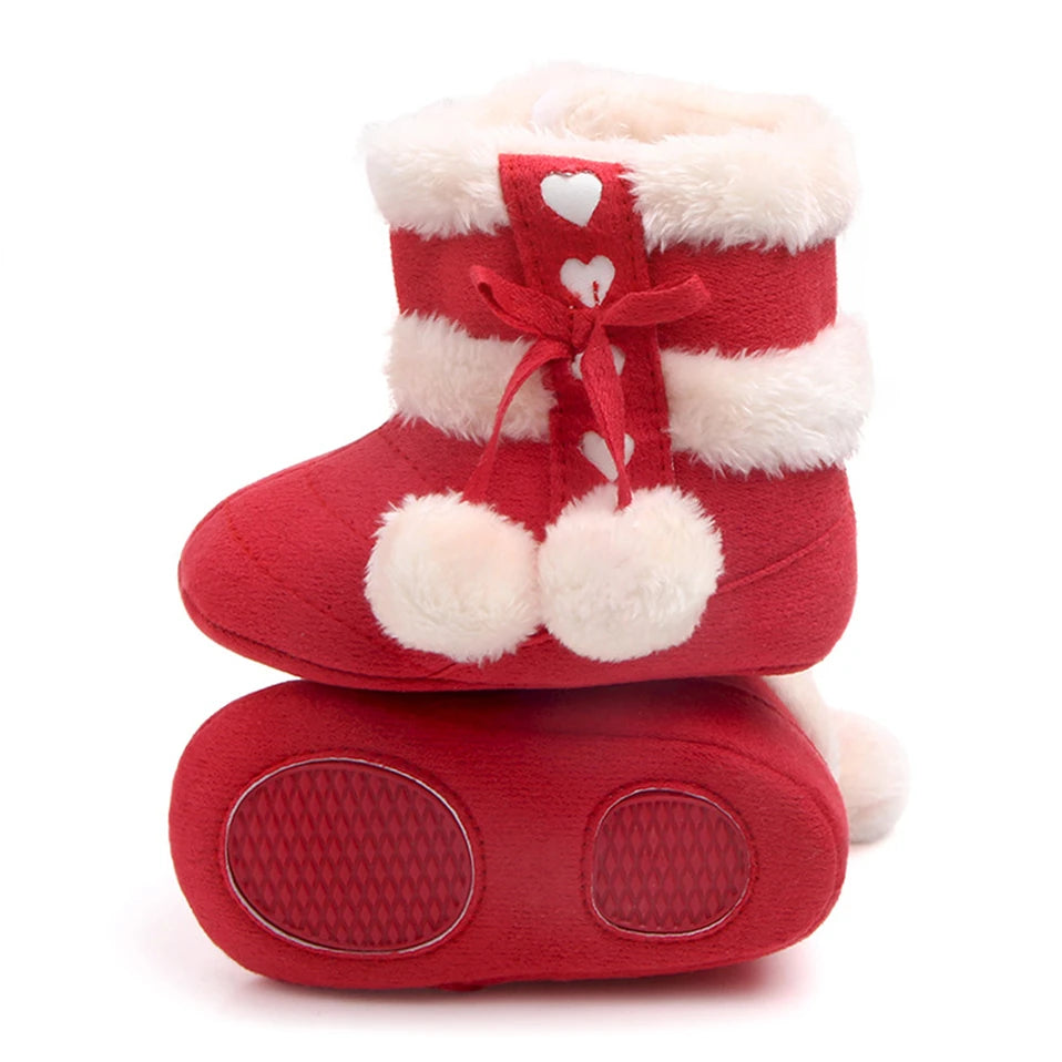 Adorable Winterberry Heart Boots for babies in rich berry red with plush faux fur and fluffy pom poms.