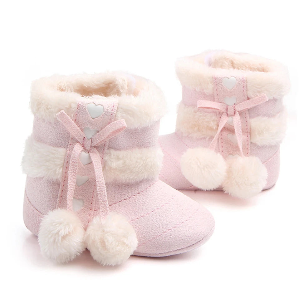 Blush Pink Heart Slipper Boots for babies with plush faux fur lining and cute pom poms