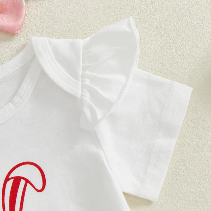 Flatlay of my first Easter baby outfit showing ruffle shoulder