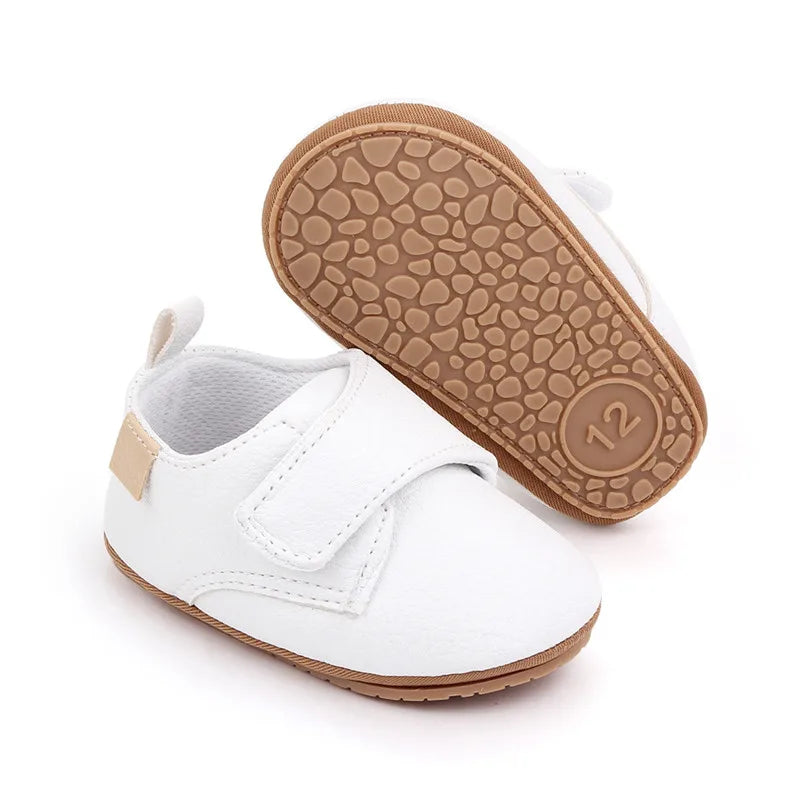 Avery vegan leather baby shoes in white, featuring a flexible rubber sole for pre-walkers and early walkers.