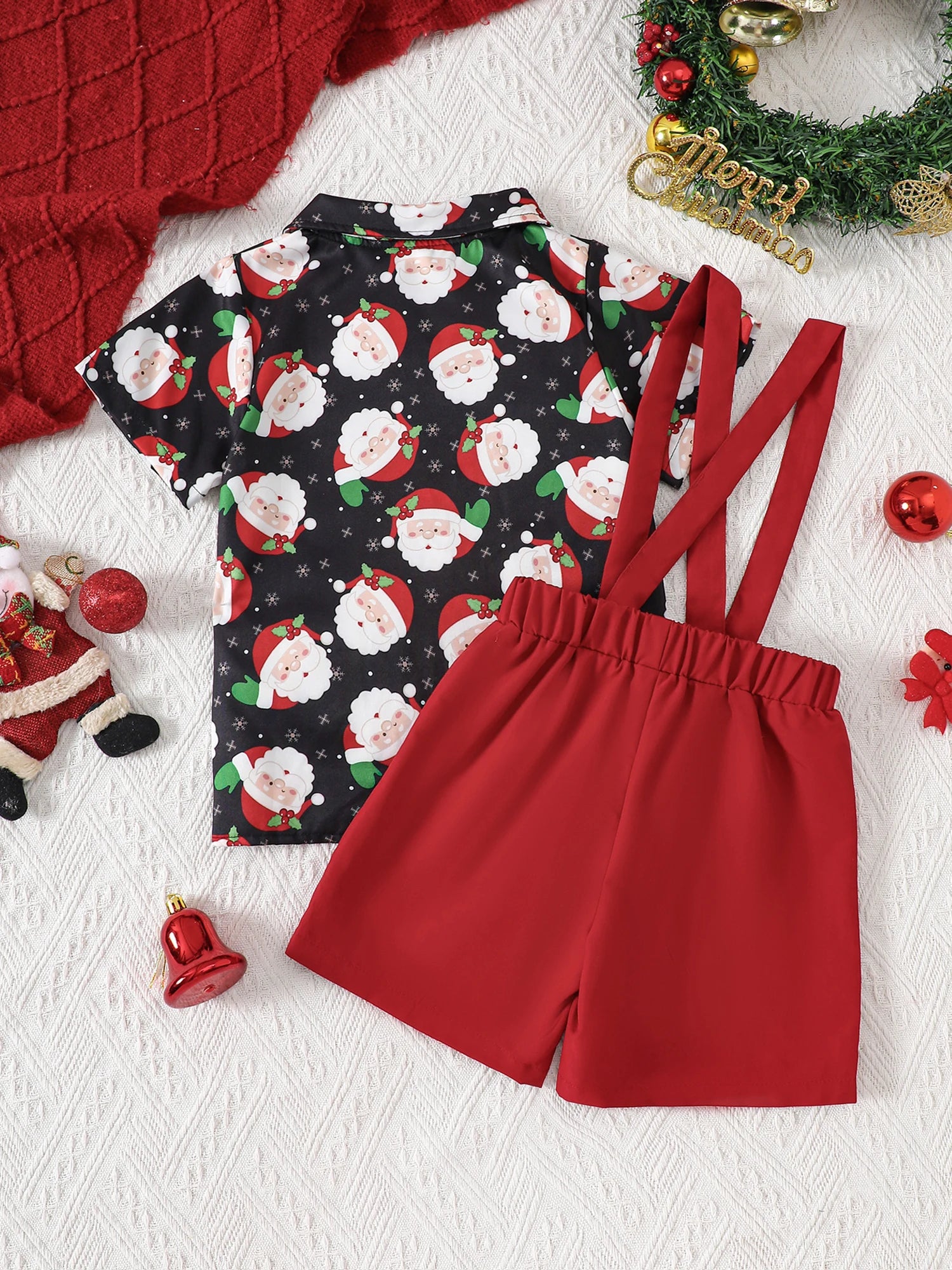 Baby boy Christmas outfit featuring a Santa suspender shorts set with a collared shirt and red shorts.