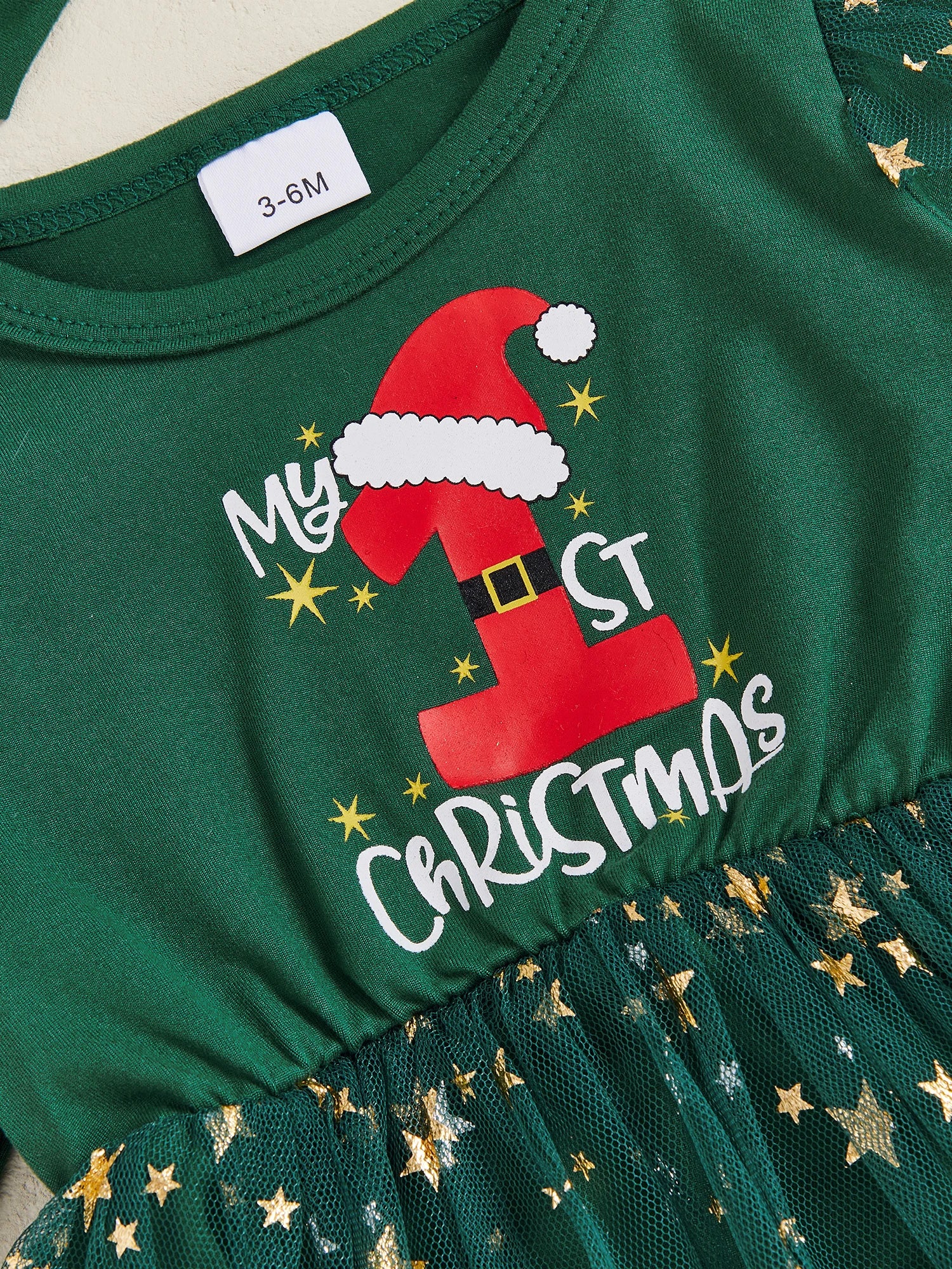 My 1st Christmas Star Tutu Dress for baby girls, festive green with Santa hat print and glittery star tutu, perfect first Christmas outfit.