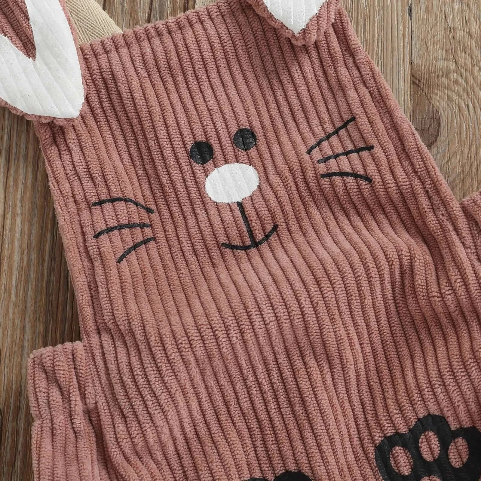 Close-up of corduroy bunny baby romper in dusty pink