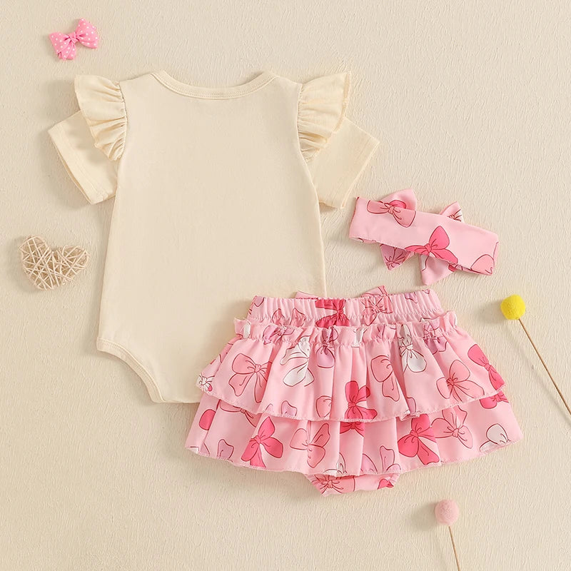 Adorable My First Father’s Day Ruffle Set featuring cream bodysuit, pink tiered skirt and headband - back view
