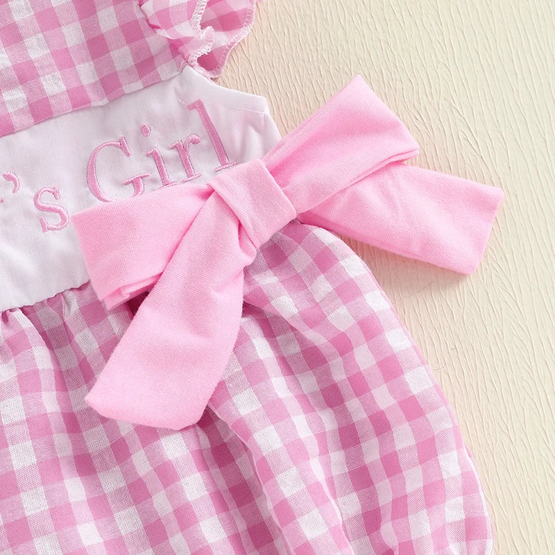 Close-up of Daddy's Girl pink gingham romper with oversized pink bow and embroidered text.
