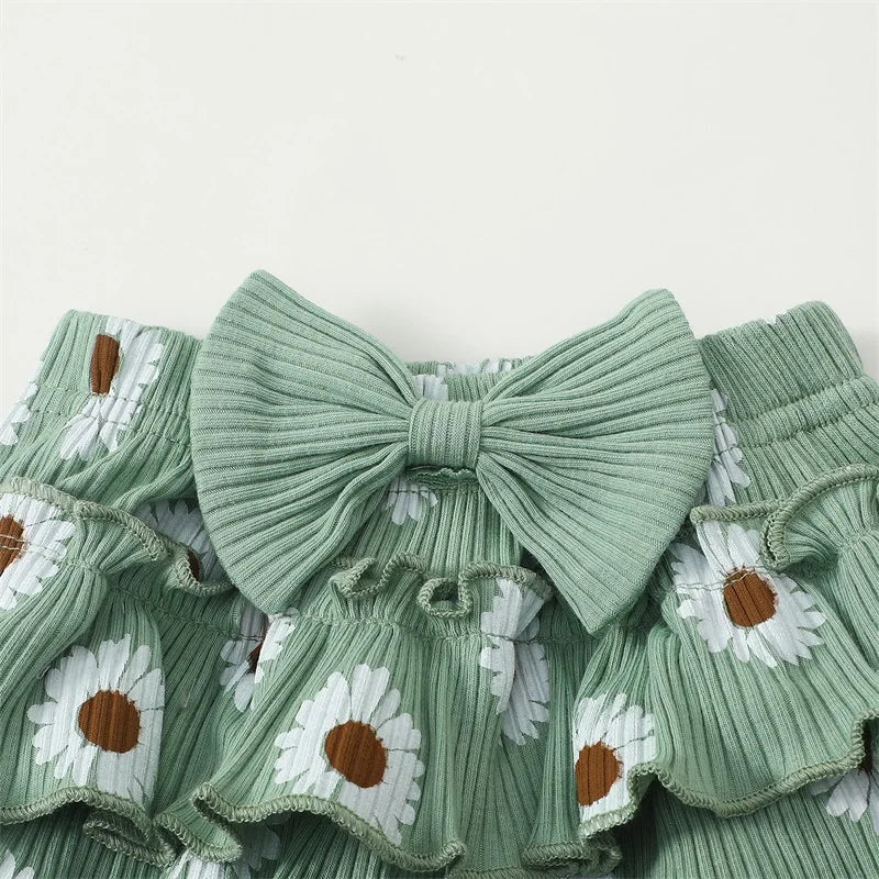 Auntie's Bestie baby girl outfit in green - closeup of ruffle bloomer skirt with big bow