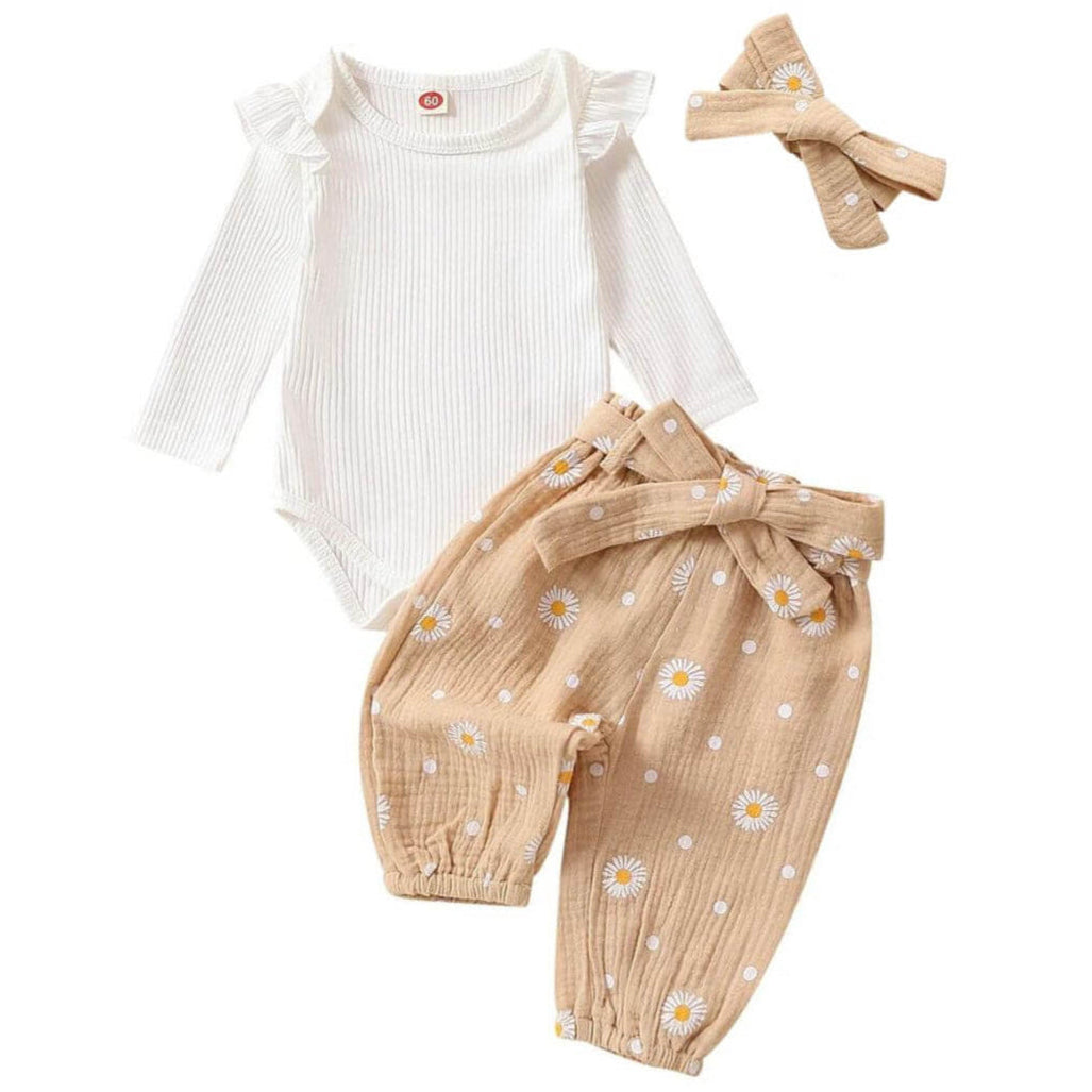 Baby girl outfit with white ribbed ruffle onesie, beige floral muslin pants and matching headband.