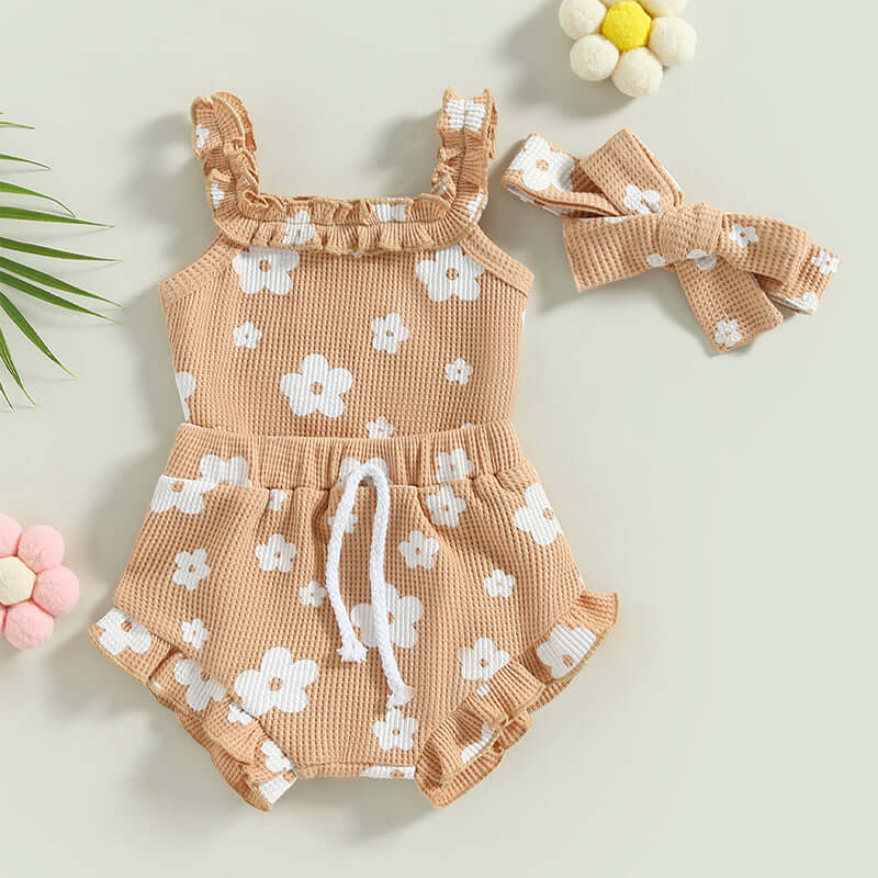 Baby girl floral romper & shorts set in beige, cotton waffle fabric styled flat lay