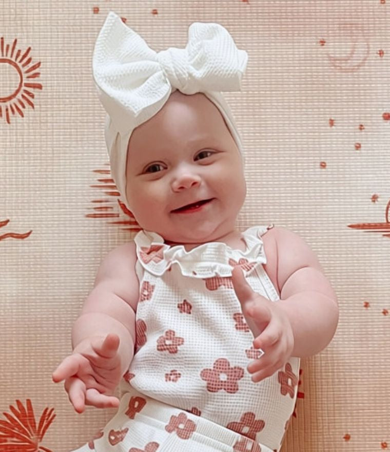 Baby girl wearing Genevieve Waffle Ruffle Set & Ivy Headband from Lulu Babe