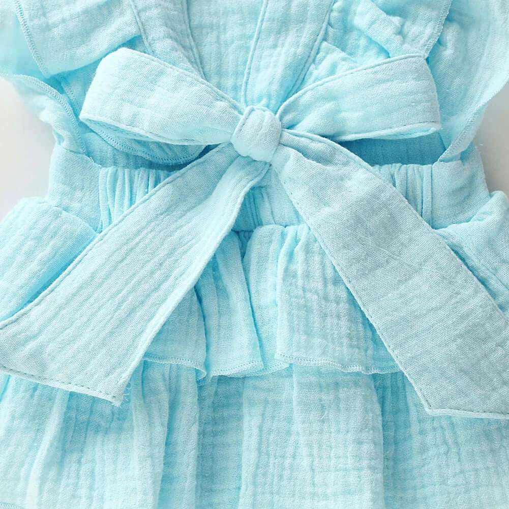 Closeup of Jennifer Ruffle Baby Girl Romper in blue showing back bow