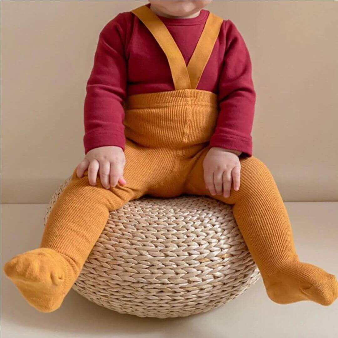 Baby wearing ribbed suspender tights in mustard - Lulu Babe