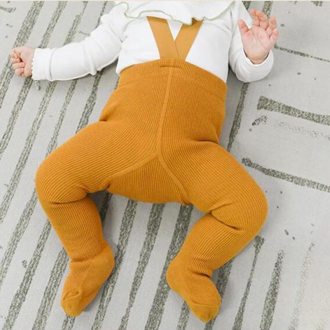 Baby wearing ribbed suspender tights in mustard - Lulu Babe
