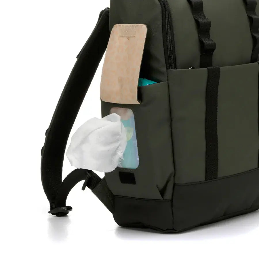 Close-up of the Babymel Finn nappy backpack in olive with Easy-wipes side pocket for quick access.