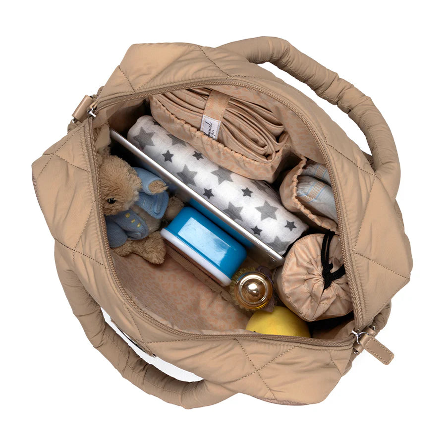 Interior view of Babymel Willow Nappy Bag in Oat showing spacious capacity