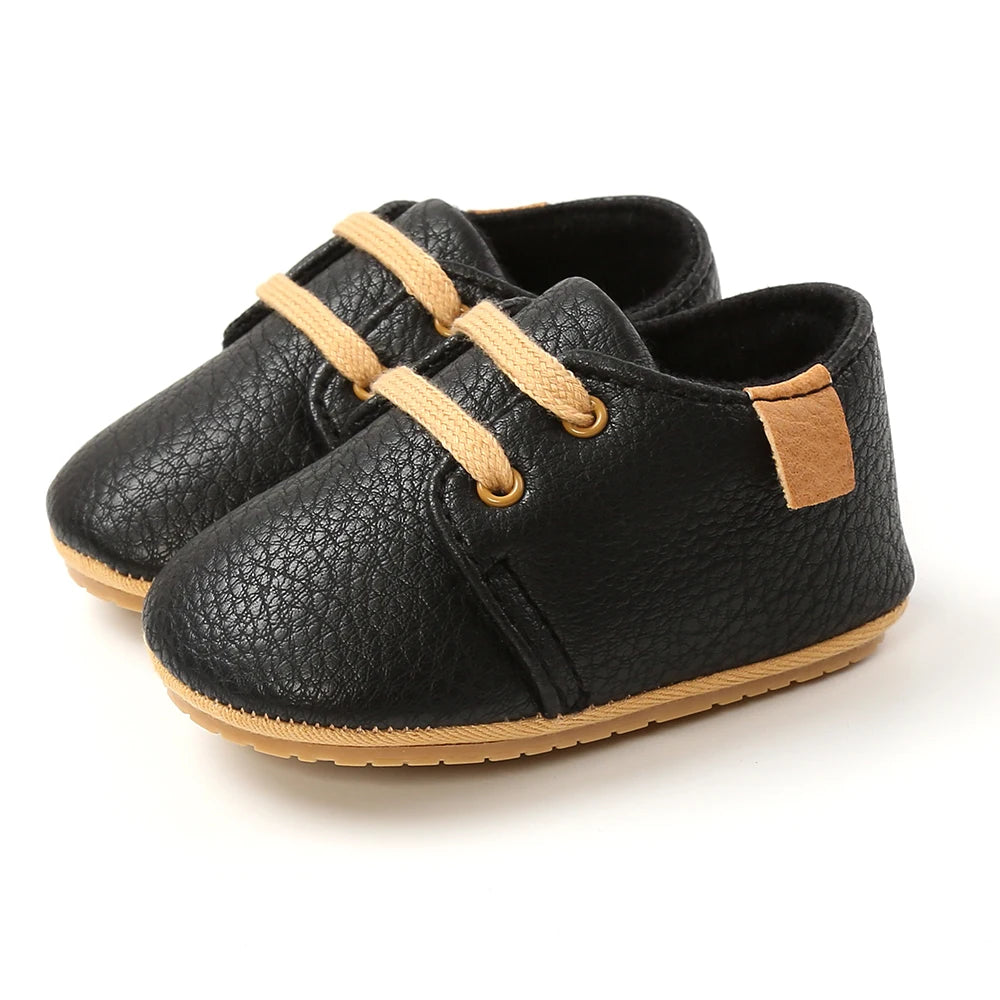 Black lace-up oxford style baby shoes