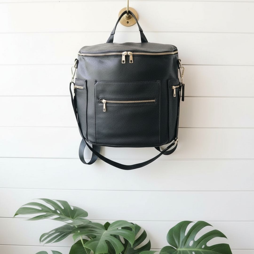 Lifestyle image of Brooklyn vegan leather nappy bag hanging on a hook