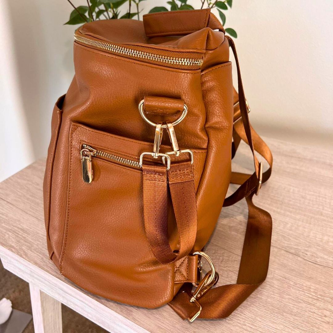 Brooklyn nappy bag in tan vegan leather - lifestyle image (side view) | Lulu Babe