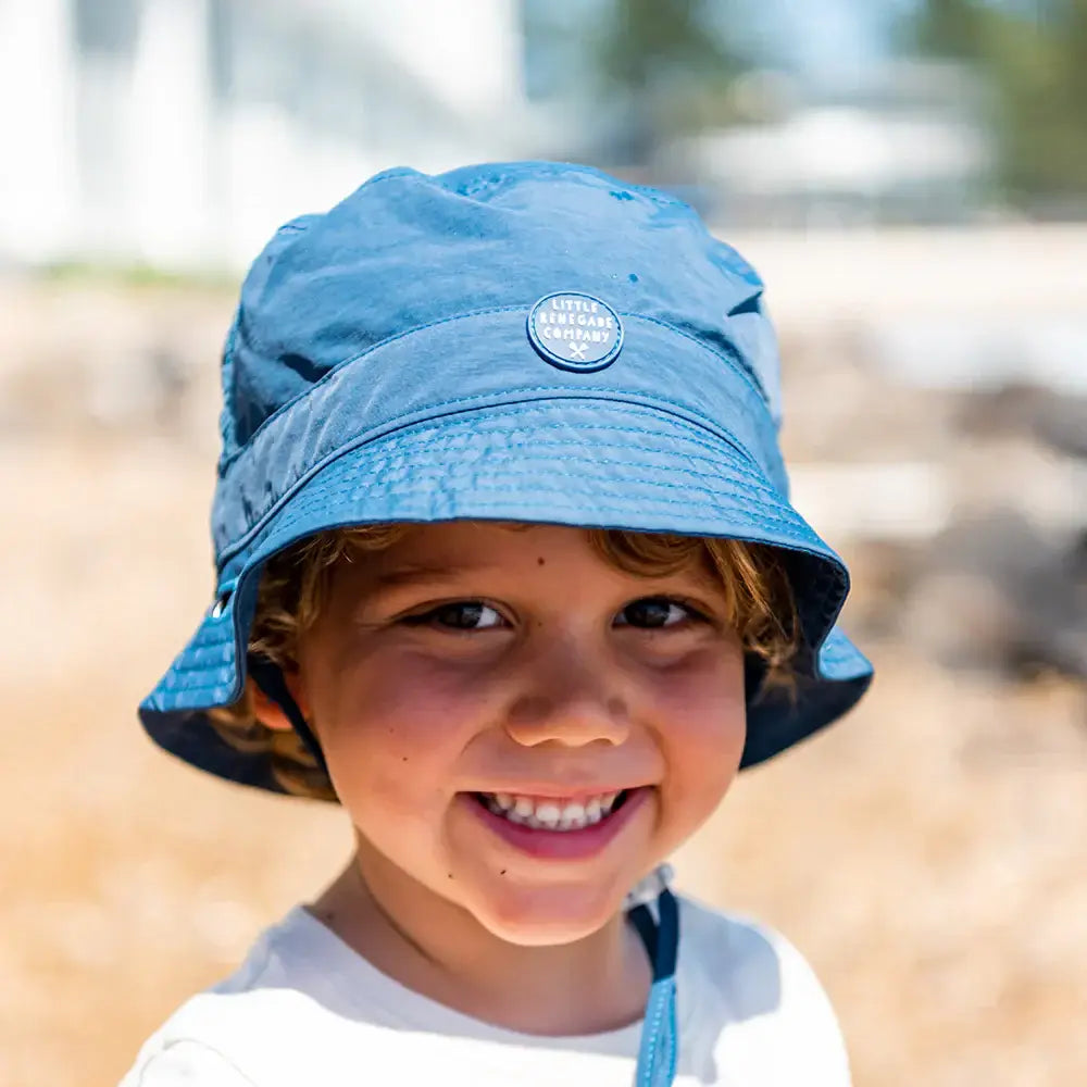 Child wearing blue bucket hat
