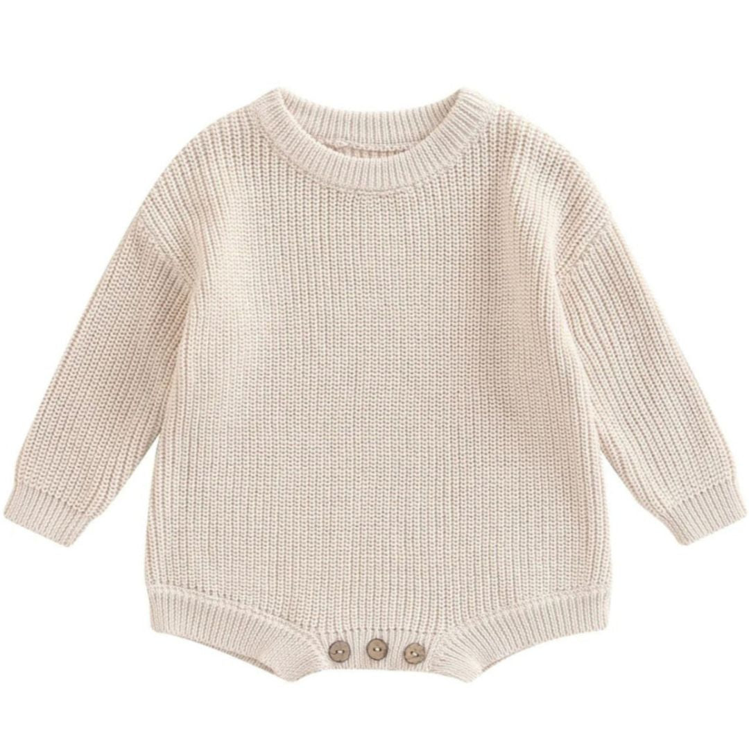 Chunky knit baby romper in sand with long sleeves and relaxed fit for winter