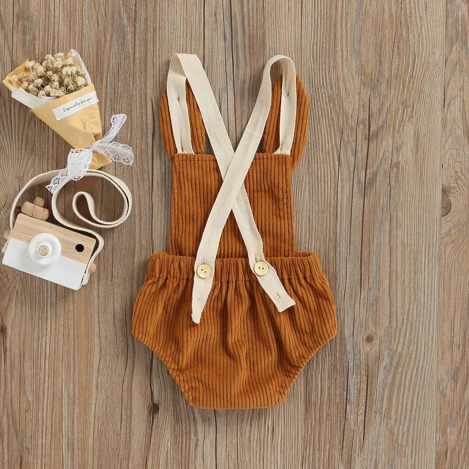 Back view of corduroy bunny baby romper with 3D bunny ears
