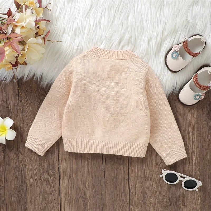 Back view of beige daisy floral cardigan for baby & toddler girls