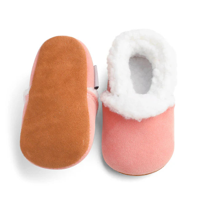 Pink fluffy baby moccasins with non-slip soles