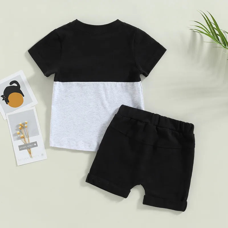 Fynn Colour Block Shorts Set featuring black and grey t-shirt with contrast pocket and shorts, perfect for baby boys.