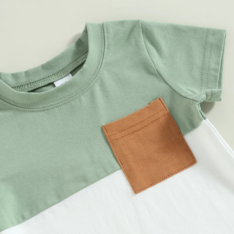 Closeup of Fynn Colour Block Shorts Set in green - showing T-shirt with contrast pocket