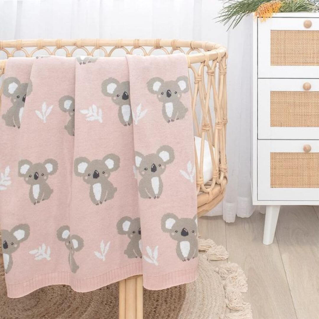 Koala baby blanket crafted from 100% cotton knit, featuring a delightful koala pattern on a dusty pink background.