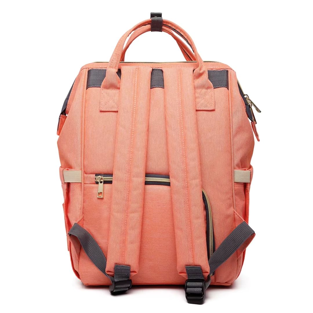 Stylish LeQueen Nappy Bag in coral colour, showing the ergonomic backpack straps and rear zip access.