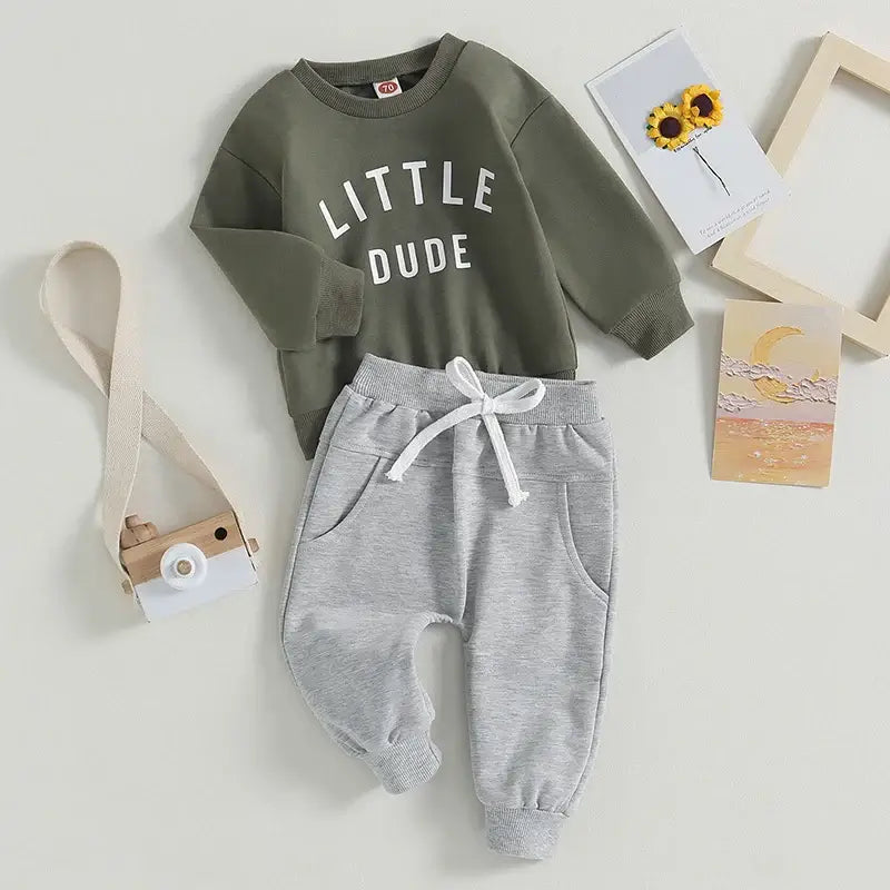 Little Dude baby boy tracksuit in olive green styled flat lay