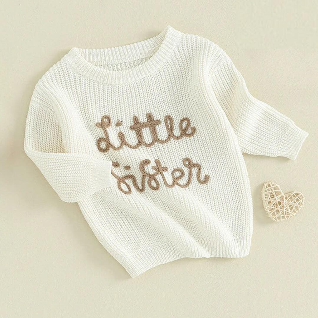 Little Sister jumper in white knit styled flat lay