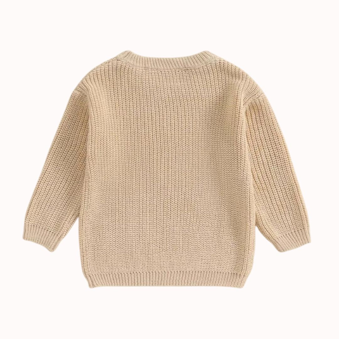 Back view of sibling knit jumper in beige