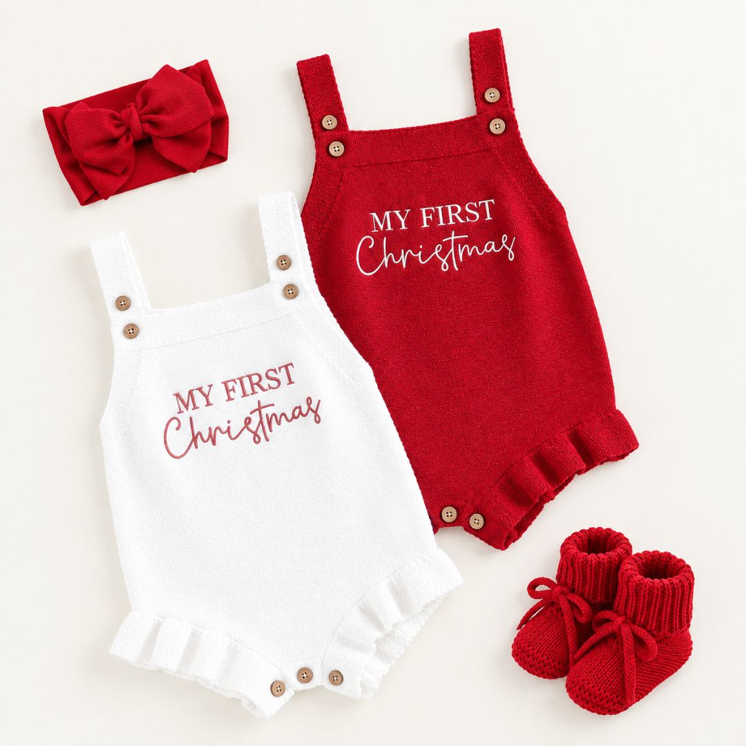 My First Christmas Rompers for baby girls – styled in a flat lay with red headband and red knit baby booties