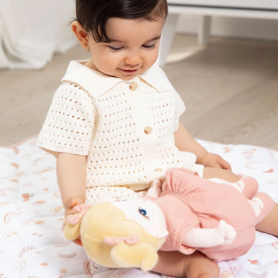 A child happily playing with My First Doll - Lola