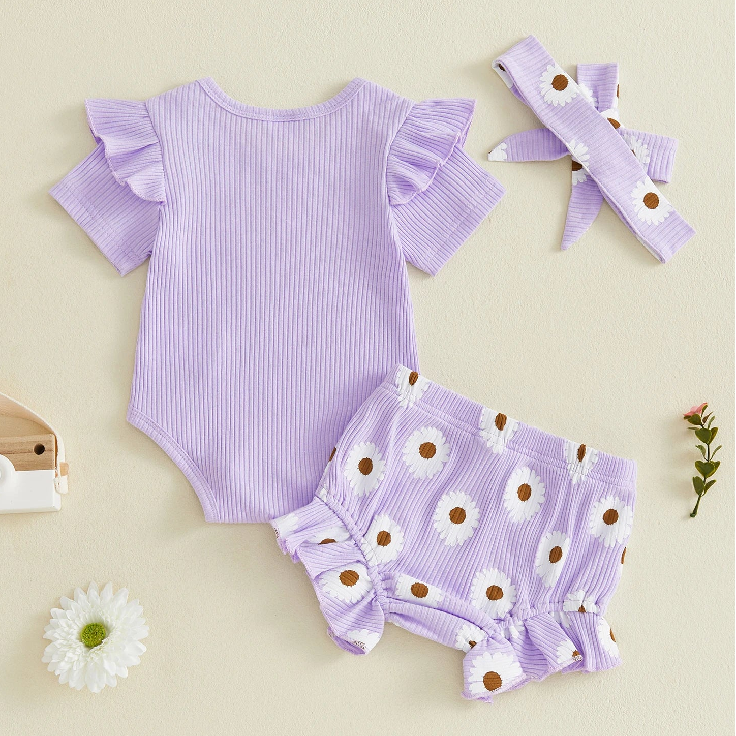 Back view of lilac baby girl outfit - "I'm New Here"
