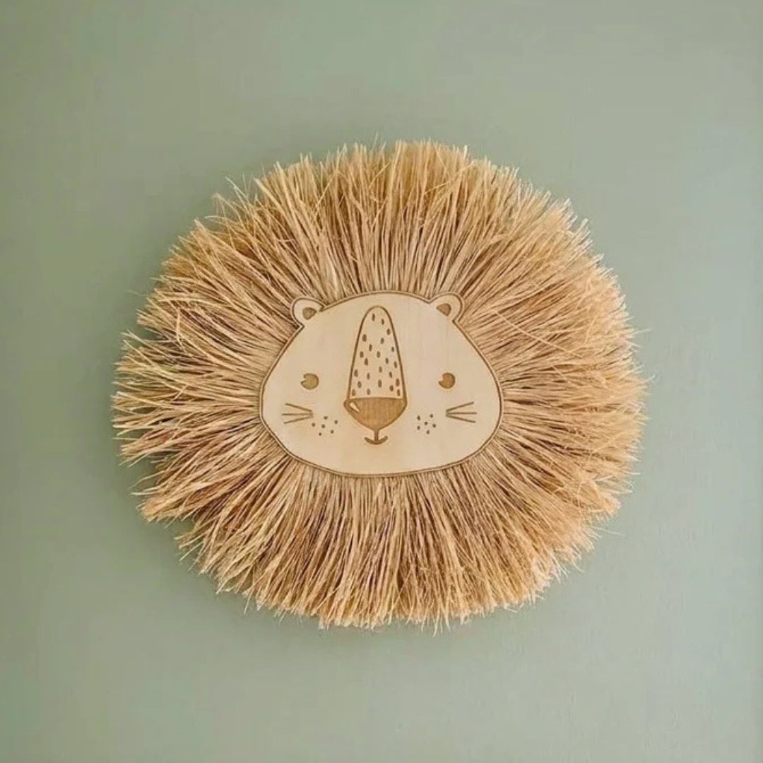 Raffia lion wall hanging on green nursery wall