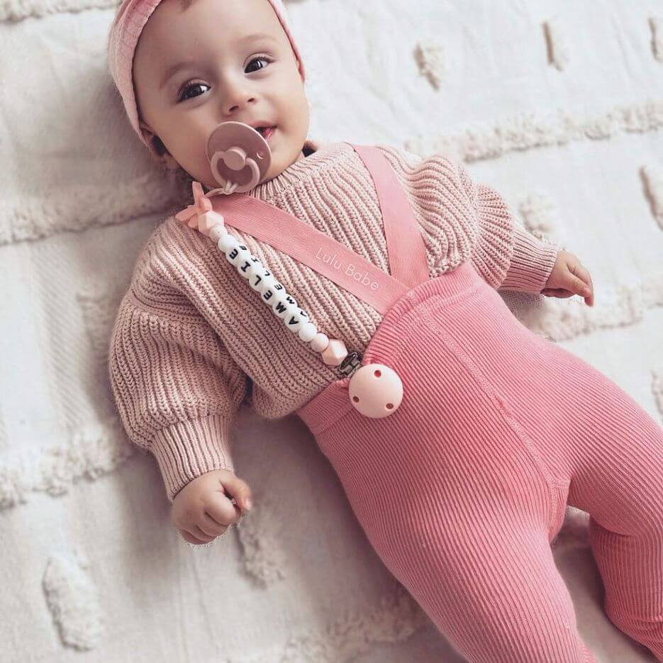 Baby girl wearing pink ribbed suspender tights - Lulu Babe