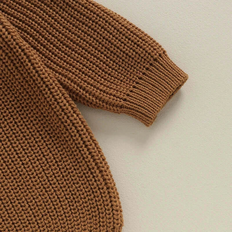 Close-up photo of sibling jumper in chocolate brown showing textured knit
