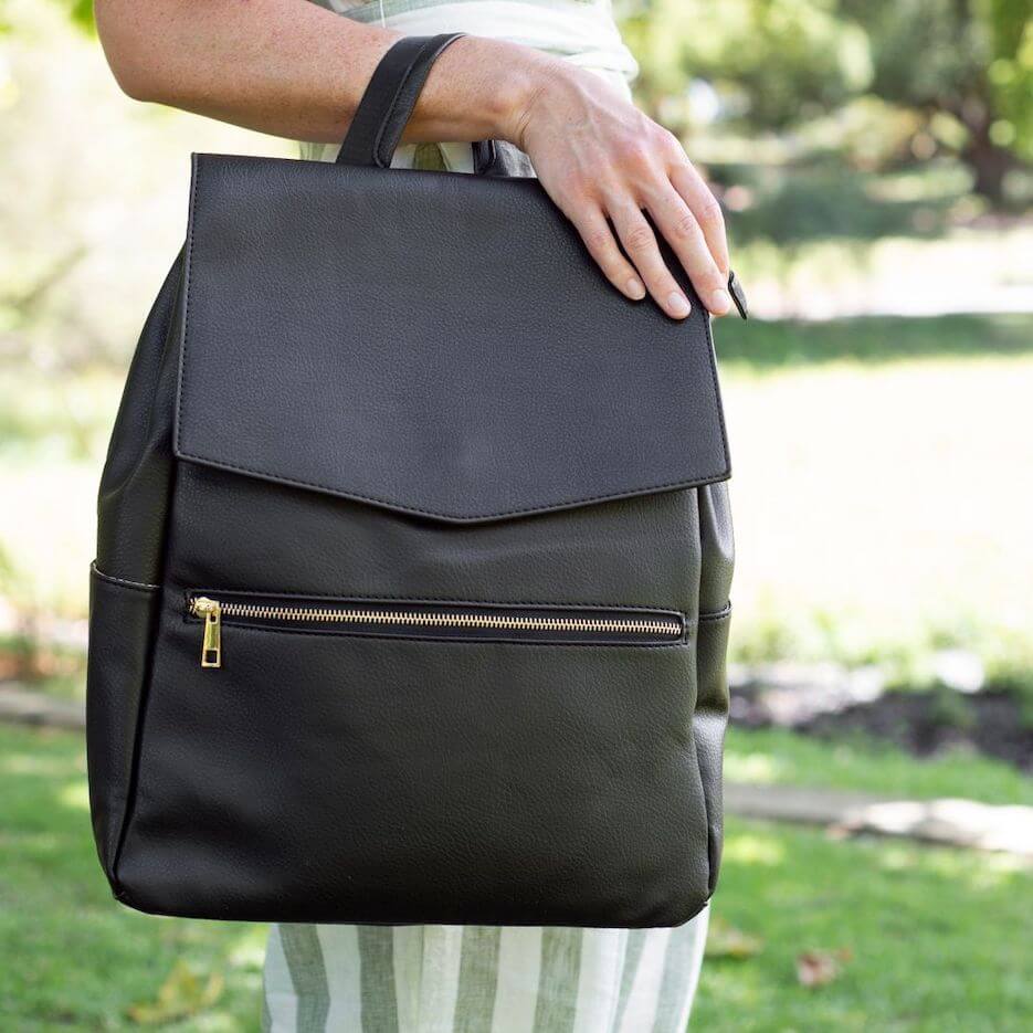 Lifestyle image of Soho nappy backpack in black vegan leather
