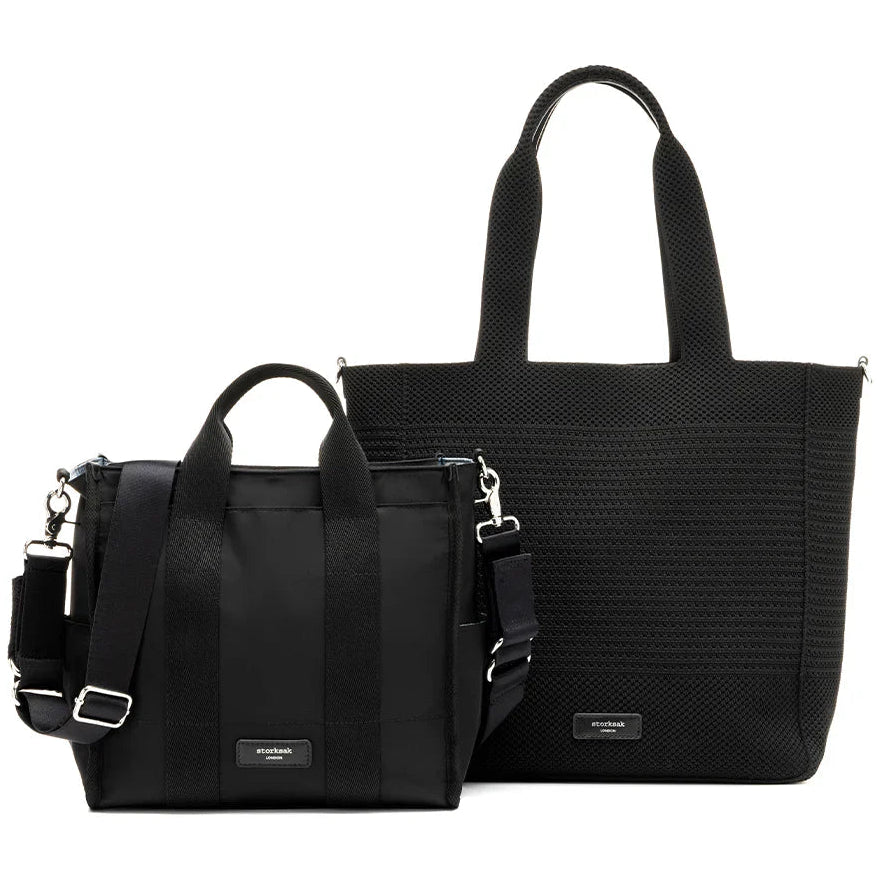 Black Storksak Thea tote bundle showing large knit tote and compact nappy bag with silver hardware