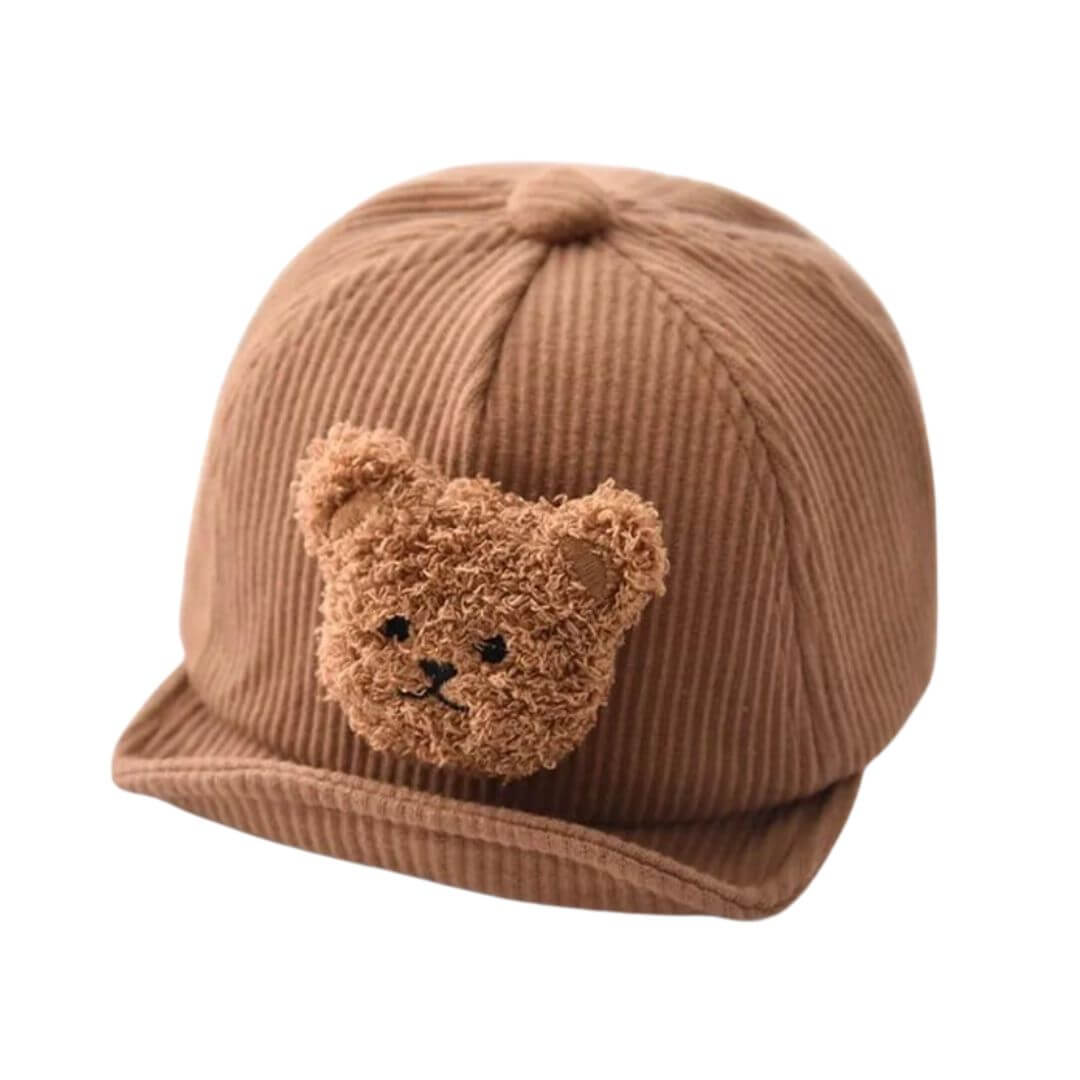 Brown corduroy baby cap with fluffy teddy bear patch