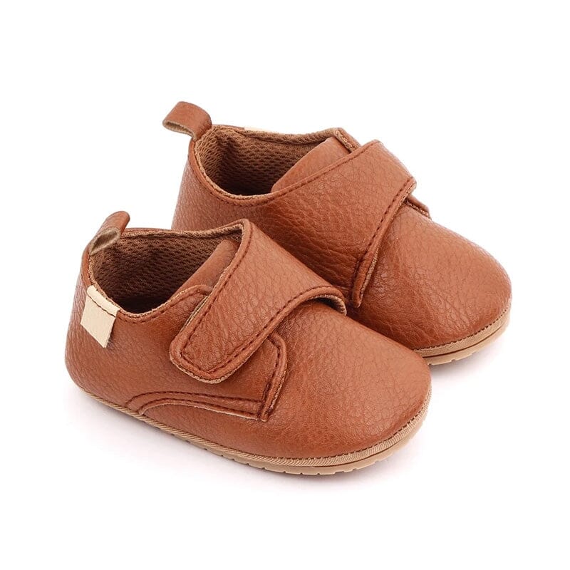 Tan vegan leather baby shoes with wide velcro strap, textured grain and pull tab