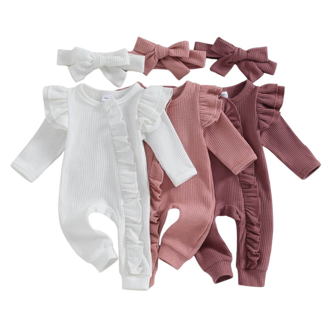Whitney Ruffle Newborn Baby Onesie with zip closure and long sleeves, available in white, pink and plum