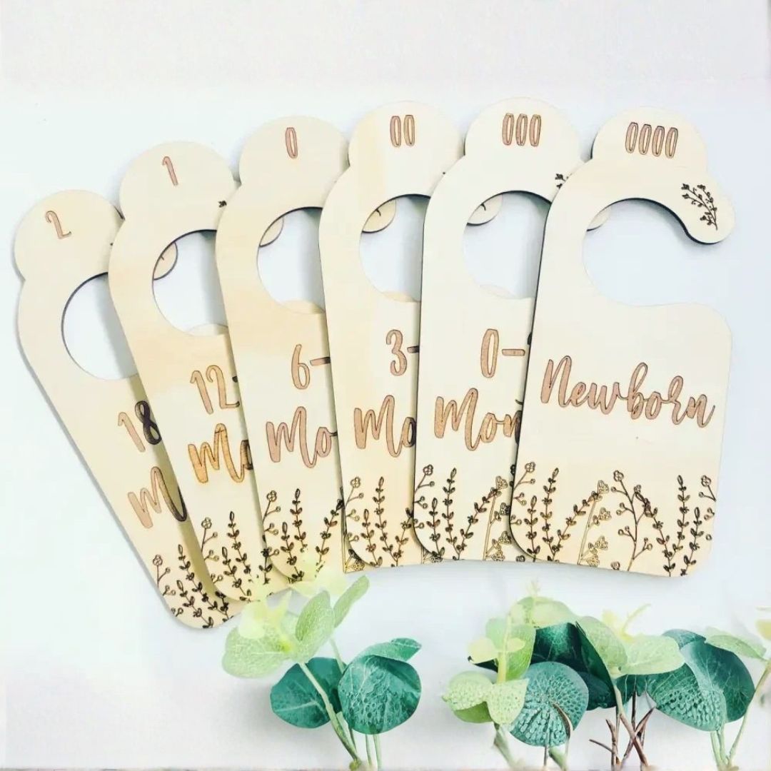 Wooden baby wardrobe dividers with botanical design for organising baby clothes