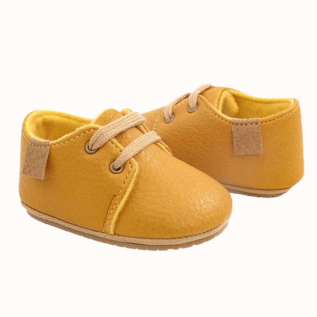 Yellow lace-up oxford style baby shoes in faux leather