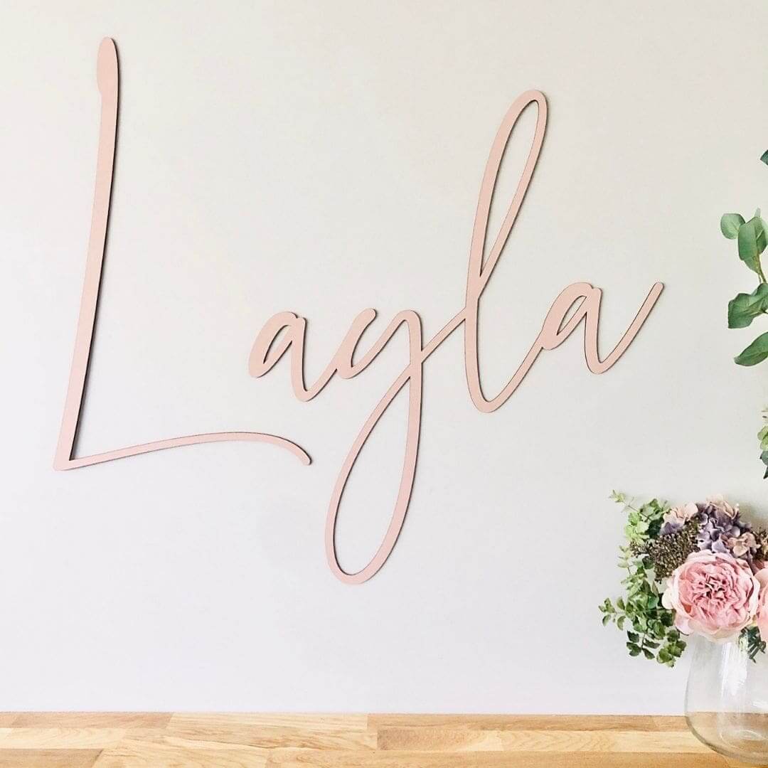 Acrylic name sign in blush pink with the name "Layla"