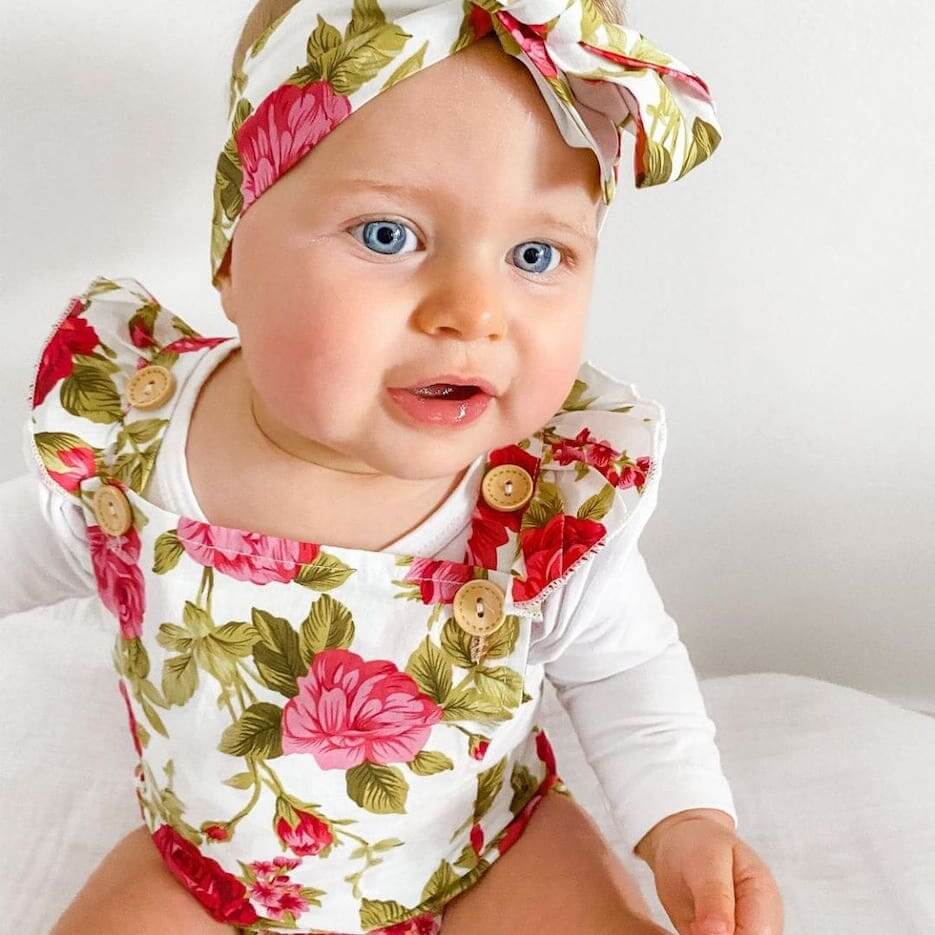 Baby girl wearing Ava Floral Romper (in 3-6 months, 6-12 month &  12-18 months & 18-24 months) - Lulu Babe