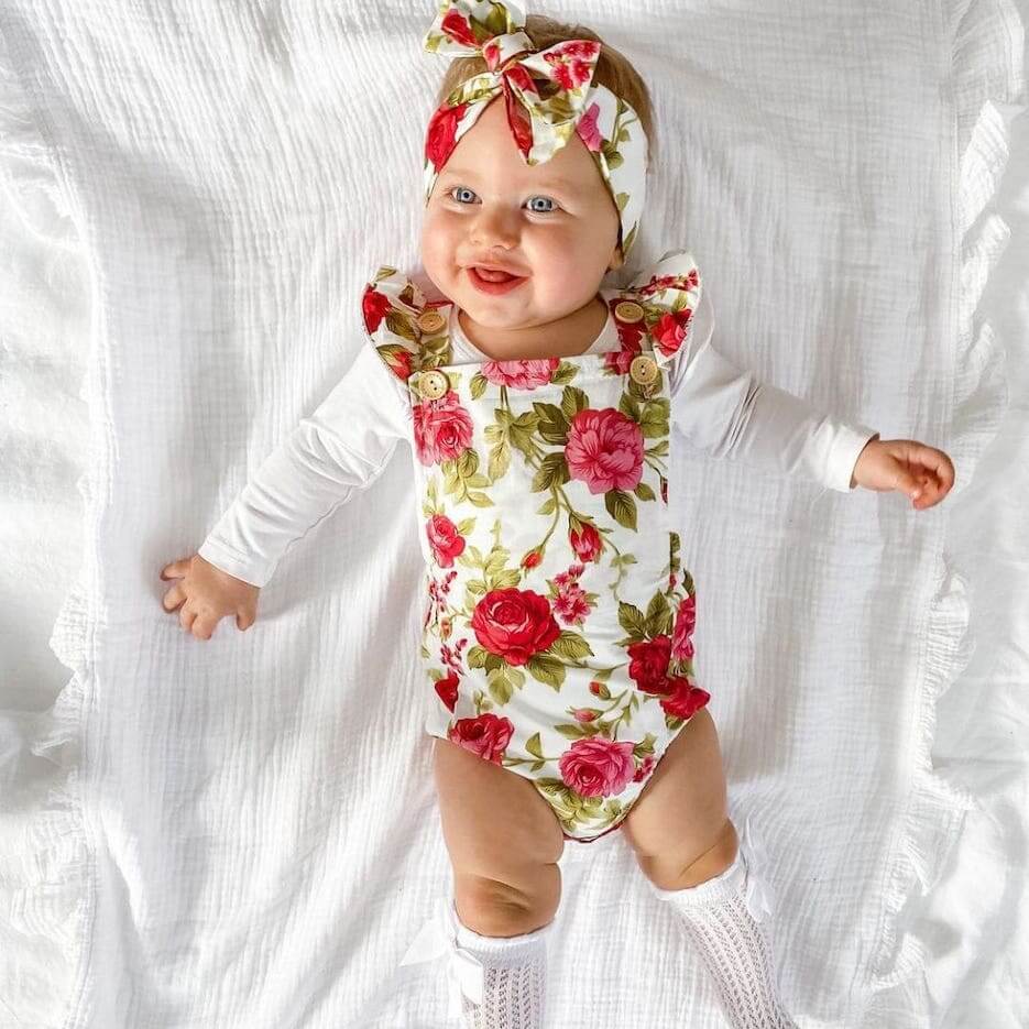 Baby girl wearing Ava Floral Romper (in 3-6 months, 6-12 month &  12-18 months & 18-24 months) - Lulu Babe